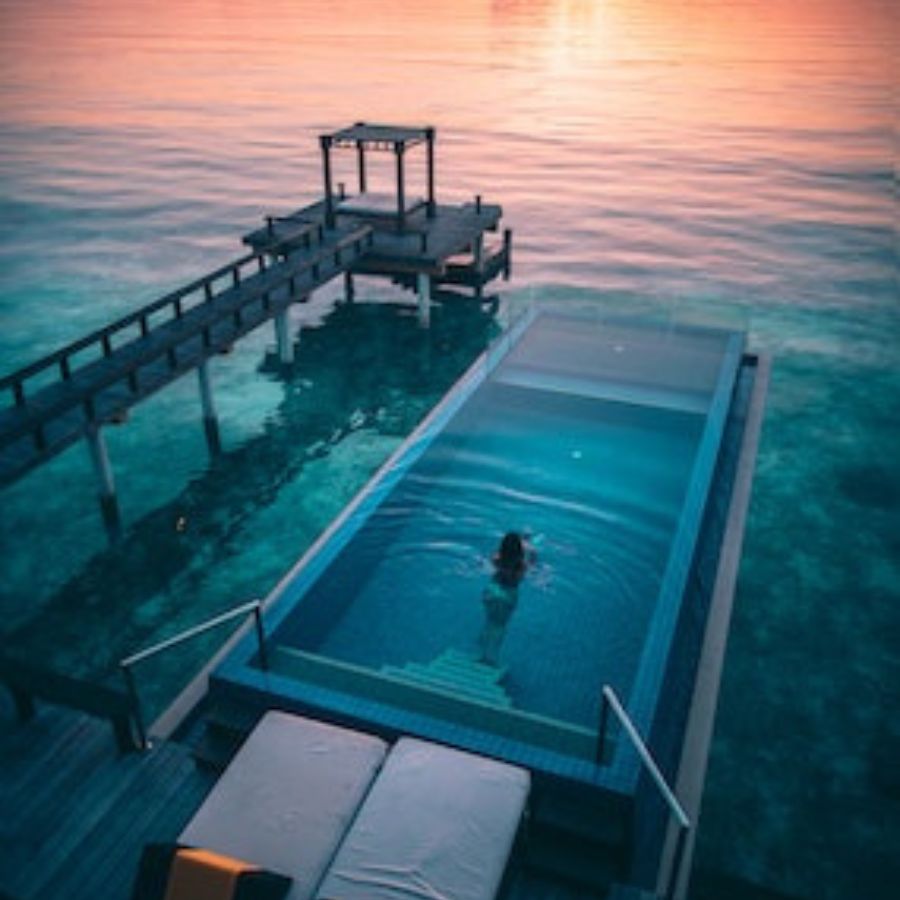 a woman swimming in a solar heated pool